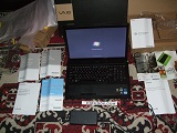 Sony VAIO VPCF23P1E booting Windows 7 on battery, near the original box.